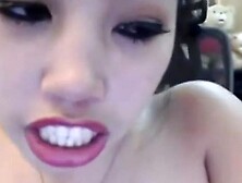 Asian webcam girl masturbates with a dildo