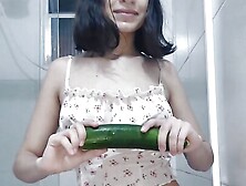 See This Beautiful Brunette Masturbating While Standing In The Bathroom With A Cucumber - Merry Christmas