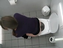 Voyeur Spies A College Girl In The Toilet