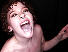 Ash Fatale,  the big mouth slut,  swallows a load through a gloryhole.