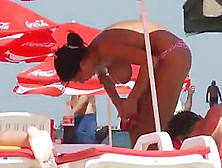 Busty Girl Shows Her Mighty Jugs On A Nudist Beach