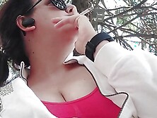 Smoking In A Public Garden Tits Outside And Feet In Flip Flops