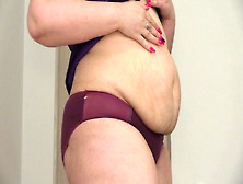 Chunky Woman With A Large Butt Shakes Stuffed Belly.  Bizarre