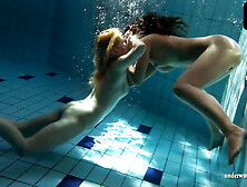 Zuzanna and Lucie kissing underwater
