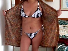 I open my dress to show myself in erotic lingerie and a bikini on the beach