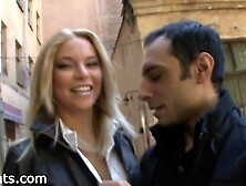 Superb Blonde Wearing A White Shirt And Black Bomber Jacket With Jeans Walks Around With A Guy While Holding His Hand