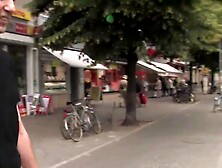 Topless handcuffed girl washes windscreens, public
