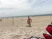 Dildo anal insertion on public beach