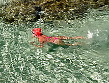 Pink bikini in a beautiful bay