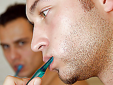 Naked Gay Hunks Brushing Their Teeths In The Bathroom As One Of Them Approaches The Other And Sucked His Piss Before Licking His