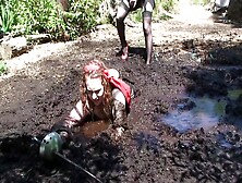 Two Female Pirates Sinking In Quicksand