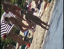 Nude Beach Filled With Hot Babes And An Unsuspicious Voyeur