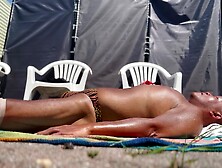 Backyard sunbathing in animal print bikini