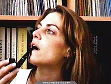 Long-Haired Lady Smoking Pipe In The Library