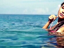 "Teenage Babe in Skimpy Swimwear Teases Viewers with Her Sexuality"