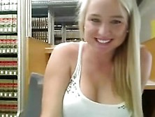 Cute blonde masturbates in library