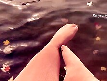 Pretty water and feet in stockings view in the Autumn!