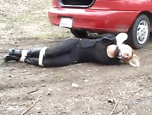 Girl In Boots Tied Up In The Trunk