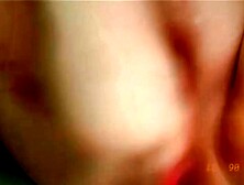 Babe with long nails uses pink toy to play