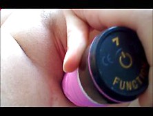 Shaved chick fucking her holes