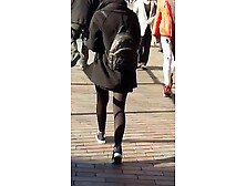 Mixed race lady in skirt and tights