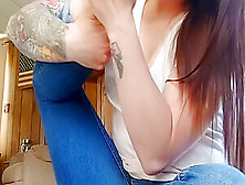 Inked Brunette In Blue Jeans Sitting On The Carpet Sucking Her Own Toe