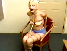 Tied In Hemp Rope,  Blue Shorts And White Socks 1