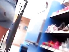 Sexy milf paying at the cashier