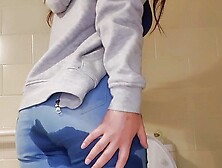 Girl With Great Ass Pees In Her Jean Pants And Plays With Her Wet Pussy