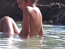 flatchested teen relaxing at the beach