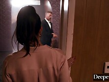 A cigar shop employee is at the service of an exacting customer.