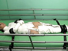 StraightJacketed & strapped to bed