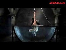 Girl With Tied Arms Tortured With Shocker Getting Her Pussy Rubbed With Dildo In The Aquarium By Master In The Dungeon