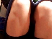 Upskirt on tube,  reading her thighs