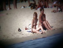 Buxom Blonde Filmed On A Nudist Beach