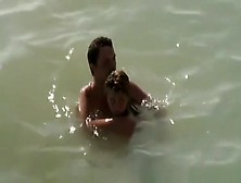 Nudist Couple Caught Fucking In The Water