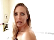 Nicole Aniston flirts with the camera while sucking some hard cock