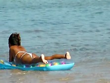 Barefoot Tanning Beauty On The Beach