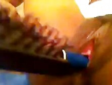 Ebony babe solo with hairbrush