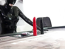 Girl in full Latex condom catsuit