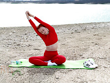 Doing Yoga Stretching Nerby Beautiful Lake