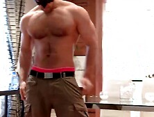 Hunky muscular and masked guy Nathan Topps solo masturbates