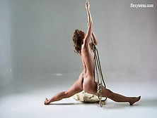 Flexible Beauty In A Bodysuit Dances And Strips