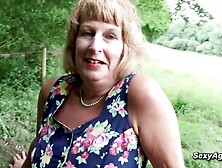 Grannie plays with her gash outdoor