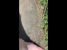 Feet Playing In A Puddle