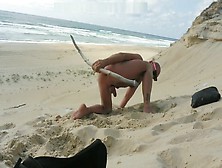 Guy Fucks Himself On The Beach With A Wooden Dildo