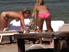 Topless Girls Relaxing By The Beach