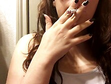 Charming Brunette Girl Smoking Virginia Slim 120 and Dangling Long Curly Hair