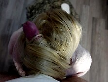 Mistress in fur robe uses her long blonde hair for oral sex