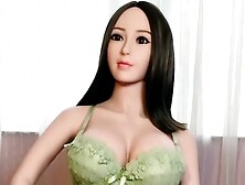 Fine oriental love doll in green bikini with monstrous boobies ready for doggystyle